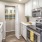 a kitchen with white cabinets