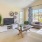 a living room with a tv and couches