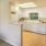 a kitchen with white cabinets