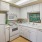 a kitchen with white cabinets