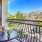 a balcony with a table and chairs