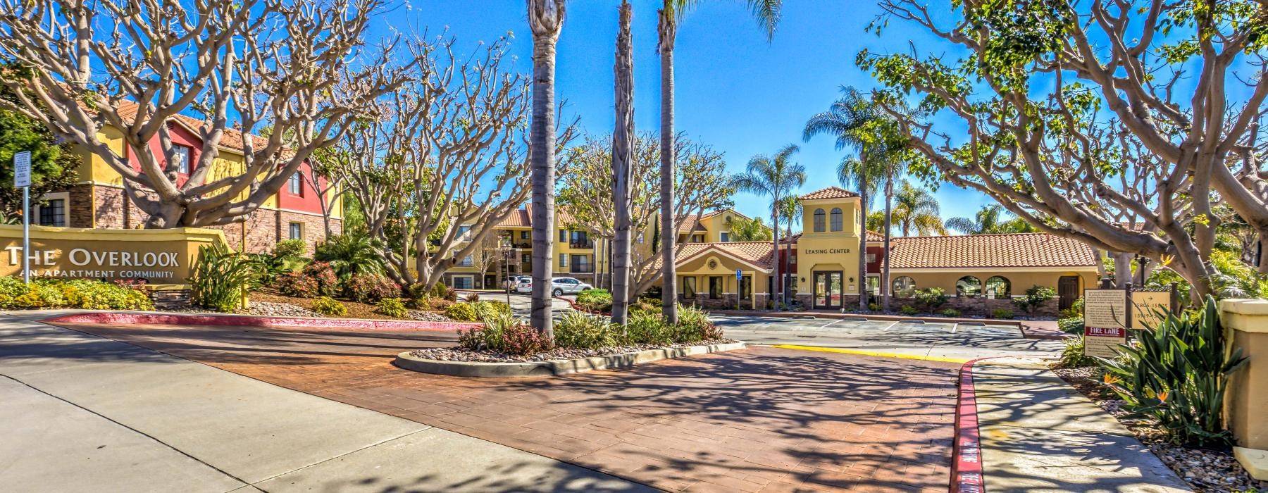 Exterior view of entrance to Overlook at Bernardo Heights apartments in Rancho Bernardo, San Diego, CA, with sign reading "The Overlook An Apartment Community"