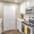 a kitchen with white cabinets