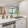 a kitchen with a sink and a plants on the counter