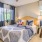 a bedroom with a bed and a fan