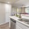 a kitchen with white cabinets